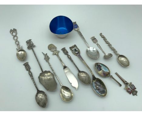 A Collection of White metal and continental silver spoons. Includes German silver 800 grade and enamel spoon. 