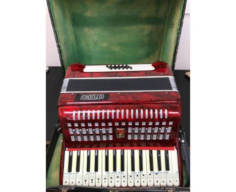 Studio Parrot accordion together with a fitted travel case. 
