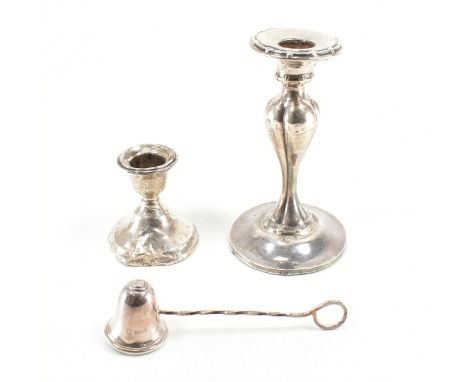 An assorted collection of hallmarked silver candlesticks &amp; snuffer. The lot to include; a gadrooned &amp; moulded candle 