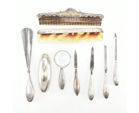 An assorted collection of hallmarked silver dressing table items. The lot to include; tortoise shell &amp; repousse mounted h