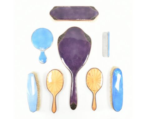 An assorted collection of guilloche enamel dressing table items. The lot to include; a hallmarked silver clothes brush with b