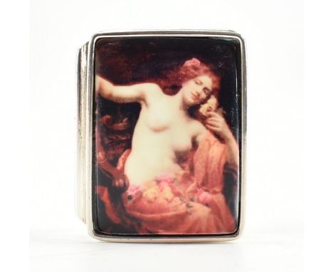 A sterling silver &amp; enamel pill box. The hinged box having a rectangular enamelled panel to the lid depicting a nude lady