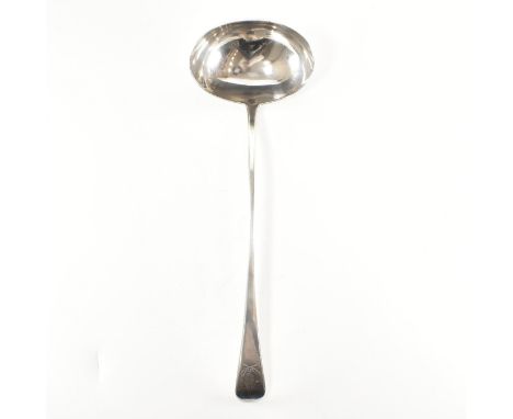 A Georgian hallmarked silver ladle. The ladle spoon having an oval oval to tapering handle &amp; etched wreathed crest to the
