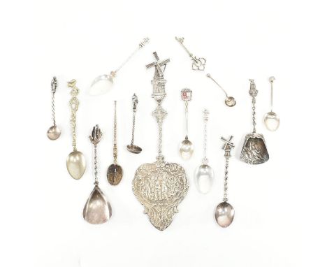 An assortment of silver items. The lot to include a bonbonniere having a rotating windmill to the terminal. Two caddy spoons,