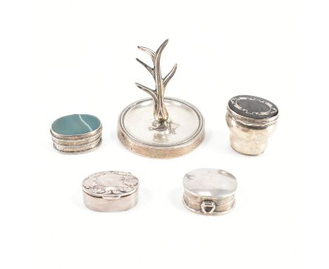 A hallmarked silver ring stand together with an assorted collection of silver trinket boxes. The lot to include; A tree form 