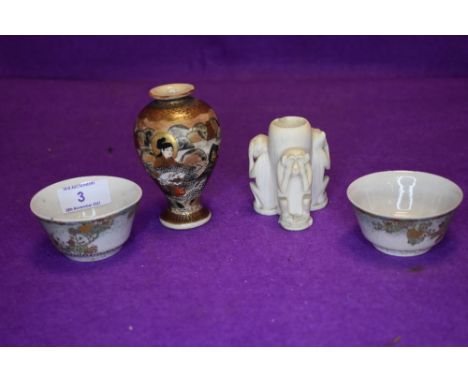 A bud vase or pot carved with the three wise monkeys, two pinch pots with extensive gilt detailing and a Japanese vase of bal