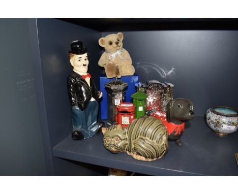 A selection of ceramic and metal money box and piggy banks