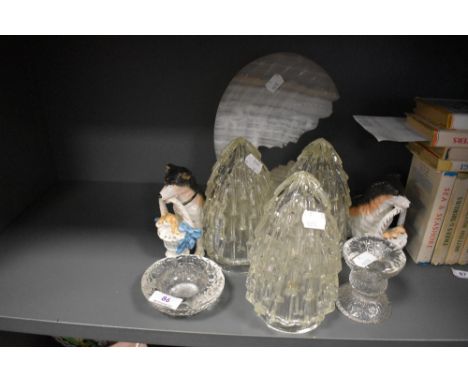 Three glass light shades a pair of porcelian dog figures and a stone cut decoration