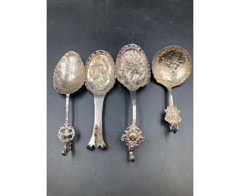 A selection of four antique silver Dutch caddy spoons