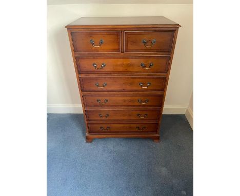 A reproduction chest of drawers, two over five on bracket feet (H120cm W80cm D47cm)