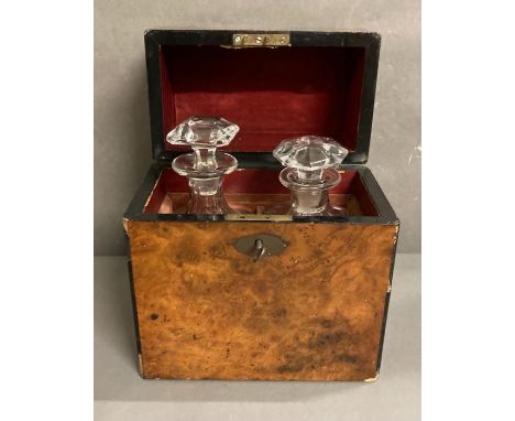 A two bottle decanter box in rosewood with key.