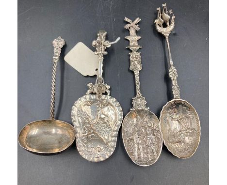 A selection of four antique silver caddy spoons