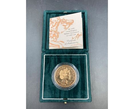 The Royal Mint 2000 United Kingdom Brilliant Uncirculated £5 Gold Coin. 22ct gold, Approximate Total weight 39.94g, boxed wit