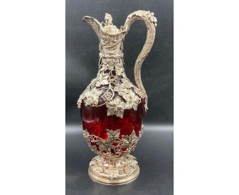 An Early Victorian Silver-Mounted Ruby Glass Claret Jug, Charles Reily &amp; George Storer, London.The baluster ruby glass ju