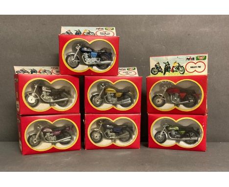 A collection of 7 boxed Polistil 1/24th scale motorcycles