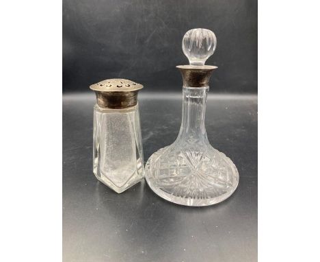 A hallmarked silver topped sugar shaker and a hallmarked silver necked decanter (18cm H)