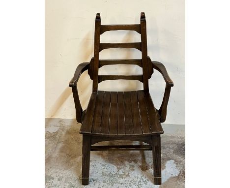 Arts and Crafts chair with a tapering ladder back 