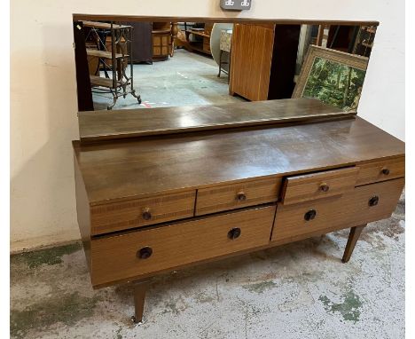 Mid Century dressing table, four small drawers and two large drawers under on tapering legs (H116cm W147cm D44cm)