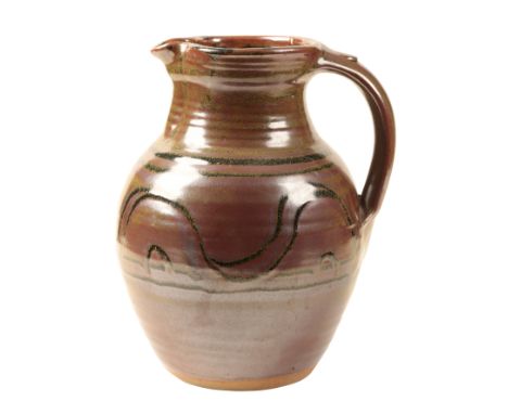 *RAYMOND FINCH (1914-2012) FOR WINCHCOMBE POTTERY: A LARGE STUDIO POTTERY JUG iron-glazed, with repeating decoration, impress