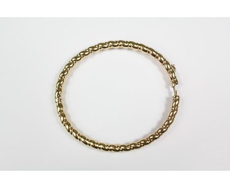 A 9ct yellow gold bangle, approx 12.9 gms.&nbsp;