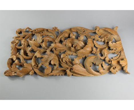 Burmese carved wood panels with foliate piercing, the largest panel approx 60 l x 29 w, the second panel approx 46 l x 30 w a