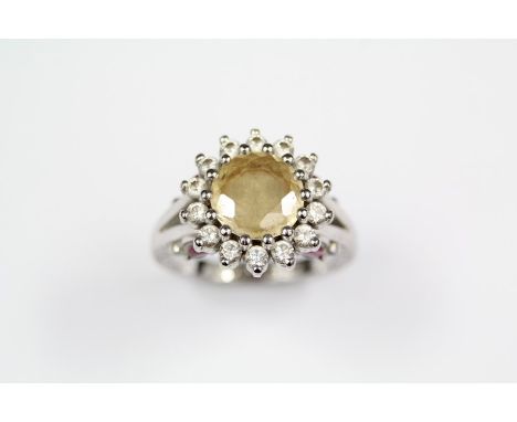 Taylor & Heart Bespoke 18ct White Gold Yellow Sapphire and Diamond Floral Ring. This hand-crafted ring set with a central rou