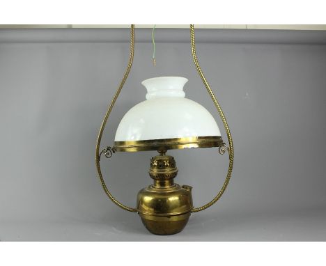 Vintage brass ceiling light, with a frosted glass shade, approx 70 cms h.