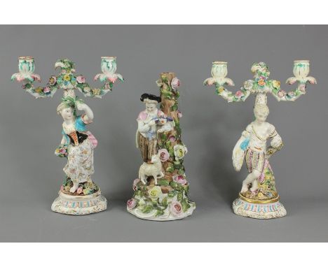 Sitzendorf porcelain candlesticks; three candlesticks. the first being a two-branch depicting a young man carrying a wheat sh