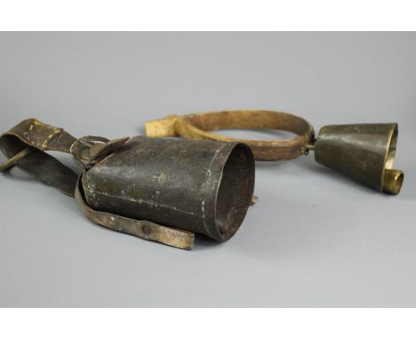 Antique olive wood goat collar, together with a vintage cowbell.&nbsp;