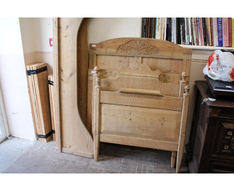 Two vintage pine single beds; the beds with carving to head board, foot with finials. approx 89 x 179 cms, perfect for childr