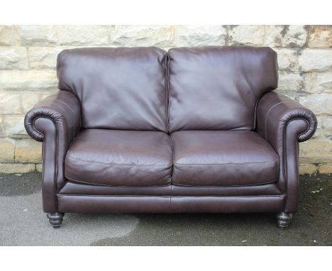Brown leather suite - comprising three seater sofa, two seater sofa and an ottoman, complete with footstool. £5000 new.