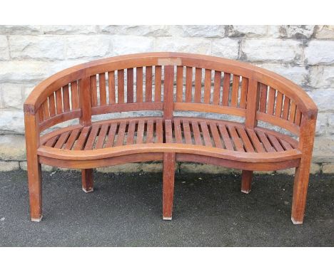 A Lutyens-style teak curved garden bench, approx 152 w&nbsp; 95 h cms.