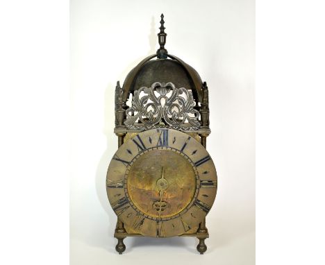 An 18th century brass striking lantern clock with anchor escapement, H. 37cm. Pendulum L. 99cm. Maker Wm. Finch, Halifax 1760