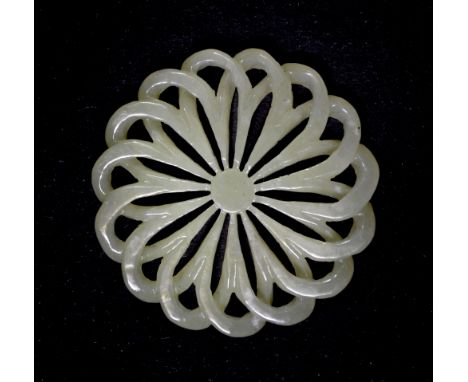 A fine Chinese jade amulet, Dia. 5.5cm, early 20th century.