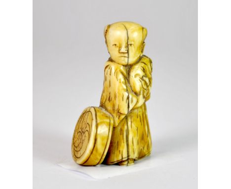 A 19th century Japanese ivory netsuke of a boy stealing the face of the moon.