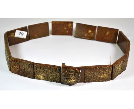 A Chinese carved brown/green jade sectional belt, L. 100cm.