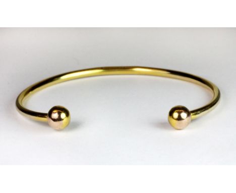 A 9ct gold torque bangle.