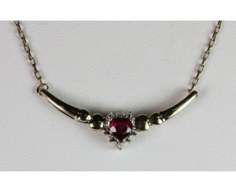 A 9ct gold synthetic ruby and diamond pendant necklace.