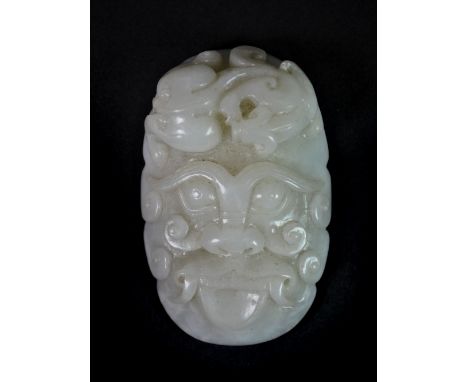 A fine Chinese carved mutton fat jade buckle, probably 19th century, Depth 8cm.