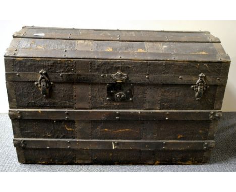 A large dome topped cabin trunk, 82 x 48 x 54cm.
