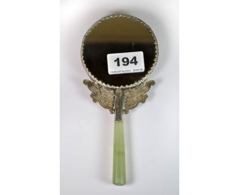 A Chinese porcelain and white metal hand mirror with jade handle, L. 18cm.