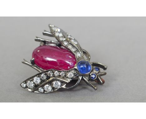 A diamond, ruby and sapphire set pin
Formed as a winged insect.  2.5 cm long. CONDITION REPORTS: One leg lacking, pin broken,