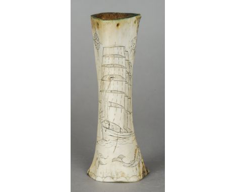 A Scrimshaw bone
Worked with a square sailed sailing ship, fish, compass and memorial cross.  21.5 cm high. CONDITION REPORTS