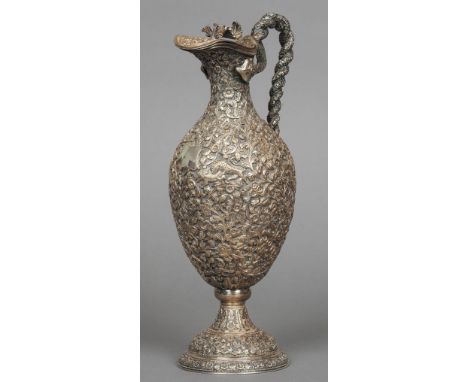 A fine quality 19th century unmarked Indian silver ewer
With scrolling double serpent handle, decorated throughout with vario