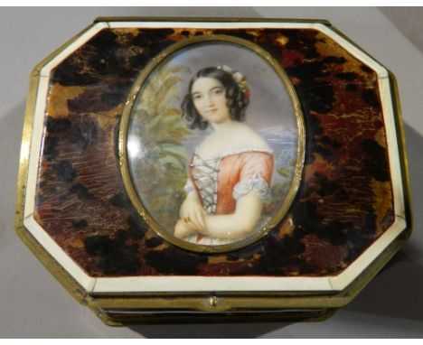 SKELL (19th century) Continental 
Portrait miniature of a Young Lady
Probably on ivory, inset to cover of a faux tortoiseshel
