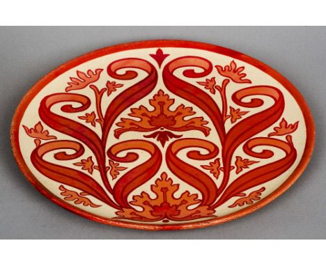A Maw & Co. Ltd. lustre ware pottery charger
Decorated with scrolling leaf, painted marks to verso.  35.5 cm diameter. CONDIT