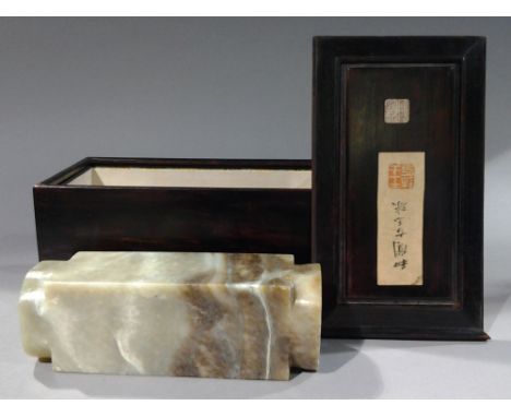 A large Chinese carved jade kong
In fitted box with applied calligraphic script and seal marks.  The kong 21.5 cm long. CONDI