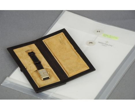 A 1940s Patek Philippe & Co. 18 ct gold gentleman's wristwatch
Of domed rectangular form, the dial with Arabic numerals and b