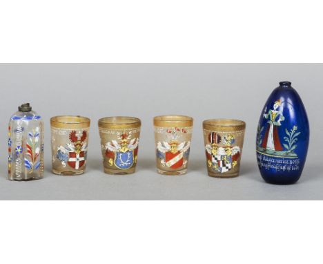 A set of four 19th century German enamelled glass beakers
Each decorated with a crest; together with a late 18th century Bohe