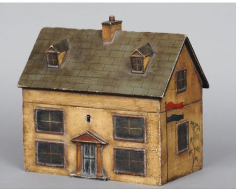 A 19th/20th century house form caddy
The hinged cover enclosing a sectioned interior, the body worked with doors and windows 